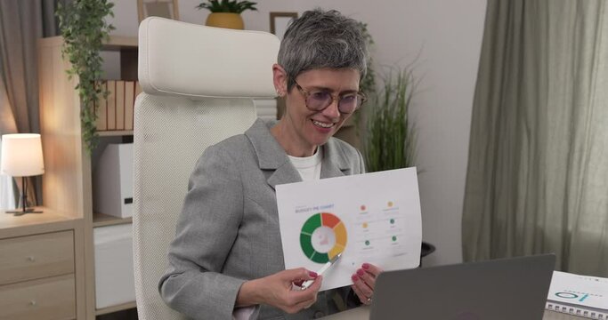 Mature woman share statistics have consultation via video call office