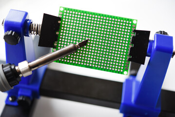 A printed circuit board for trace elements. Radio electronics. A holder for printed circuit boards.