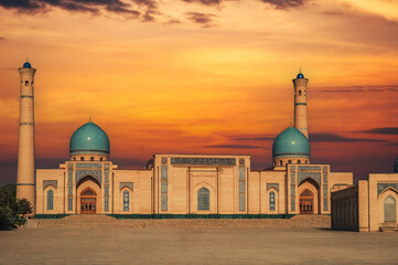 ancient religious Muslim mosque Hazrati Imam part of the architectural complex Khast Imam on square in Tashkent at sunset in summer