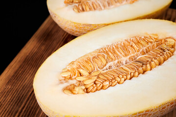 Melon halves on a wooden board