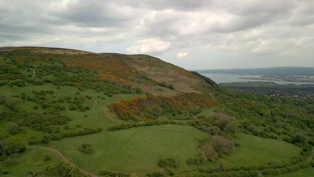 Aerial shot of Cavehill, Belfast on a spring day.

The camera begins close-up and moves away from the mountain.

Produced in 4K, 60fps and in Rec709 color space.