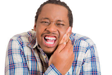 Closeup portrait handsome young man touching face having really bad pain tooth ache isolated on...
