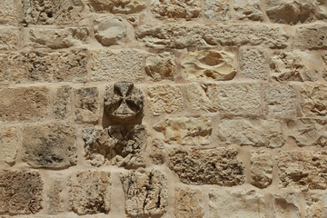 Background with a cross on an antique wall in Jerusalem