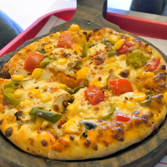 Vegetables loaded cheese and vegetables pizza.