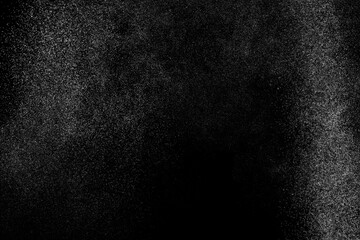 Black and white grunge texture background. Abstract splashes of water on dark backdrop. Light...