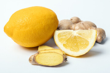 Ginger slices and fresh lemon on white background