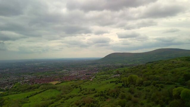 Aerial shot of Cavehill, Belfast on a spring day.

The camera begins on the right and moves left to reveal Belfast City.

Produced in 4K, 60fps and in Rec709 color space.