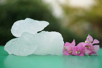 Crystal clear alum stones or Potassium alum decorated with flowers. Useful for beauty and spa...