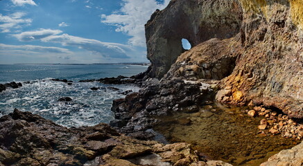 Obraz premium Russia. The Far East. The Kuril Islands. The picturesque rocky coast of Iturup Island in the Sea of Okhotsk.