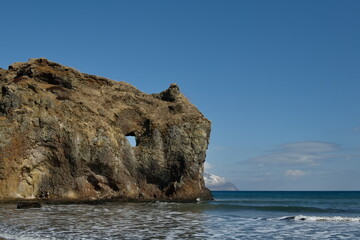 Russia. The Far East. The Kuril Islands. The picturesque rocky coast of Iturup Island in the Sea of Okhotsk.