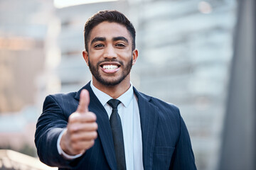 Businessman, portrait and thumbs up in city for agreement, commercial law career and vote of trust....