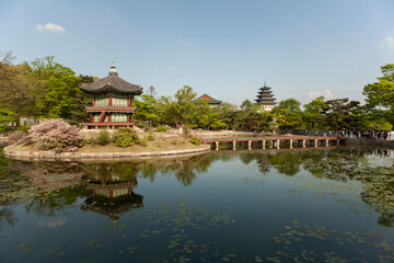 Naklejka premium View of the traditional wooden pavilion on the pond in the palace