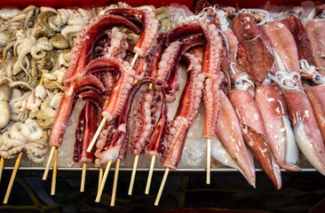Skewed squid and seafood to be grilled in a street shop in Phuket, Thailand