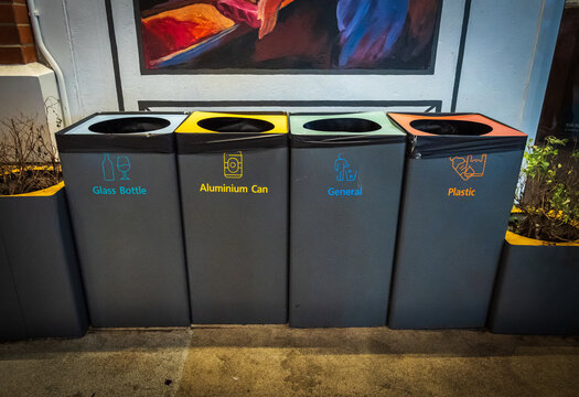 Modern recycling bins for different materials seen in Bangkok nightlife, Thailand