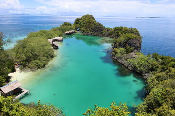 Aerial view of Rufas island with its lagoon in the middle located in Raja Ampat, West Papua
