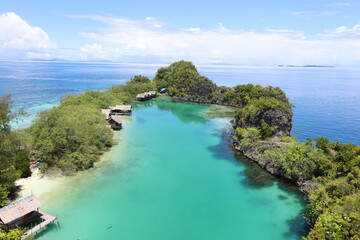 Aerial view of Rufas island with its lagoon in the middle located in Raja Ampat, West Papua