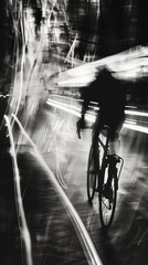Silhouetted cyclist in motion on illuminated street