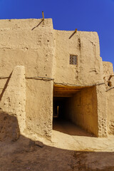 Typical mud house village, in the Sahara Desert