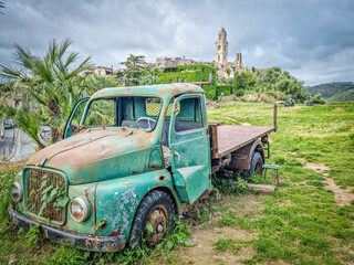 Abandoned car in the ghost town of Bussana Vecchia, Italy