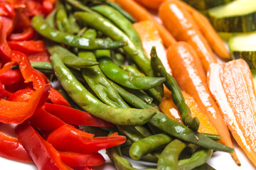 Boiled vegetables. Steamed zucchini, green bean, carrots, pepper. Low calorie diet concept.