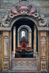 Ancient votive shrine of Pandra Shivalaya with Shiva Lingam in Pashupatinath Temple in Kathmandu, Nepal, religious symbol in Hinduism emanates sacred aura and divine energy