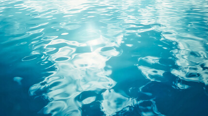 clear blue sea water surface with light reflections texture