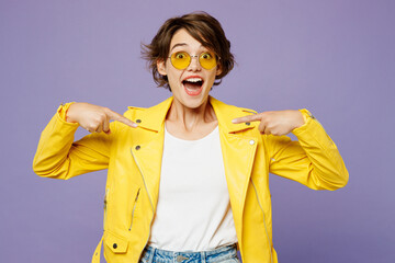 Young surprised woman she wear yellow shirt white t-shirt casual clothes glasses holding index finger up with great new idea isolated on plain pastel light purple background studio. Lifestyle concept