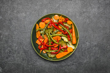 Asian food. Stir fry vegetables on plate, top view of mixed vegetables.