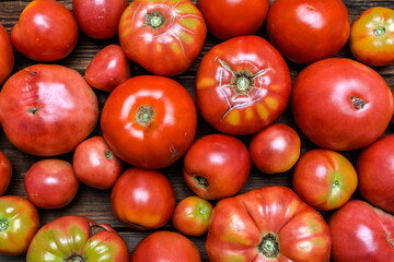 Bio tomatoes on farmer market. Farm fresh tomatoes on wooden table. Organic vegetables background.
