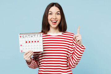 Young woman wear red casual clothes hold female periods pms calendar check menstruation days hold...