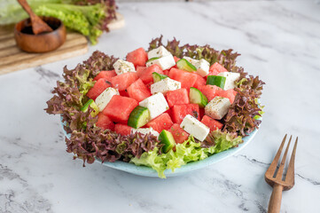 Plate with fresh tomato, cucumber and cheese