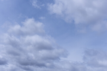 Clouds form when atmospheric water vapor condenses on small particles floating in the air