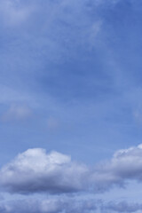 Fototapeta premium A landscape of blue sky with white spring clouds loaded with water. Vector fluffy texture background