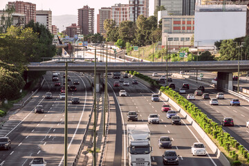M30 urban ring road within the city of Madrid with several lanes in each direction and a multitude...