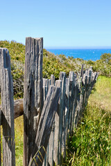 rotting wood fence along the coast