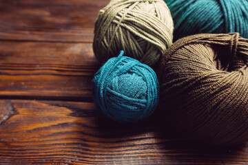 Knitting yarn  balls on wooden table        