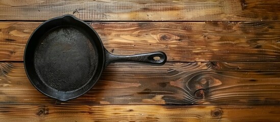 Iron Pan on Light Wood Grain Kitchen Tabletop