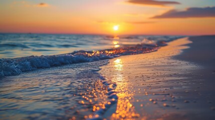 A closeup stock photo captures a stunning sunset over a tranquil beach, perfectly poised for travel and leisure advertising