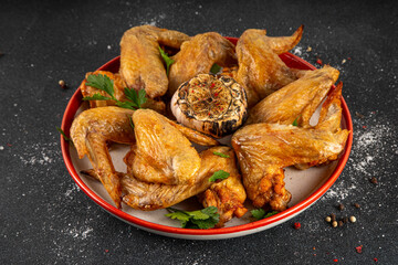 Grilled roasted spicy chicken wings with ketchup