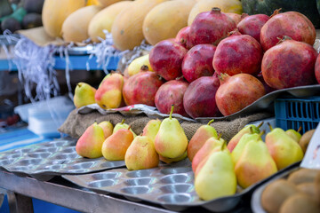 Bazaar selling summer fruits in shop showing plenty types of fruits and variations of choices