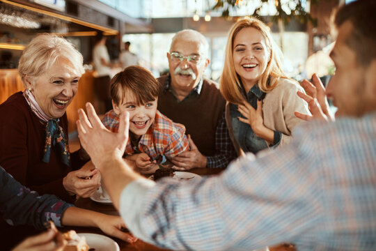 Family enjoying time together at a cafe during Christmas