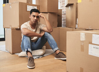 Man, sad and thinking with boxes in home with depression for divorce, moving and separation from partner. Person, packages and thoughts of memory or reminiscing of past, unhappy and wonder of payment