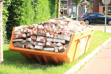 Bricks in a Garbage Dumpster