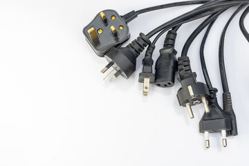 Several wires with different plugs on isolated white background