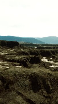 black volcanic basalt rock formations in the low light