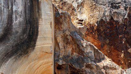 the contrast of natural texture of cliff rock and cutting rock