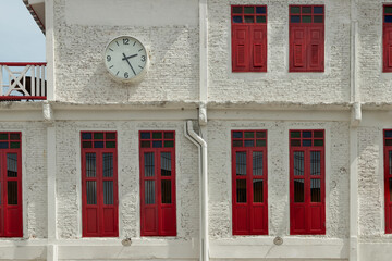 Architecture exterior view of Chinese style building with Round white watch face. Concept and...