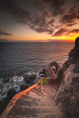 Stairs to the ocean at the sunset © Ilia