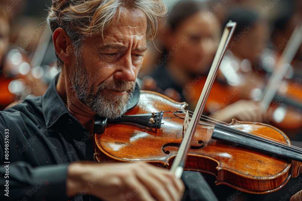 Aufkleber blurred faces focus on musicians' hands and instruments during an orchestral performance emphasizing