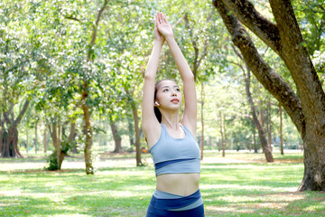Woman exercising in the park exercise concept health care.